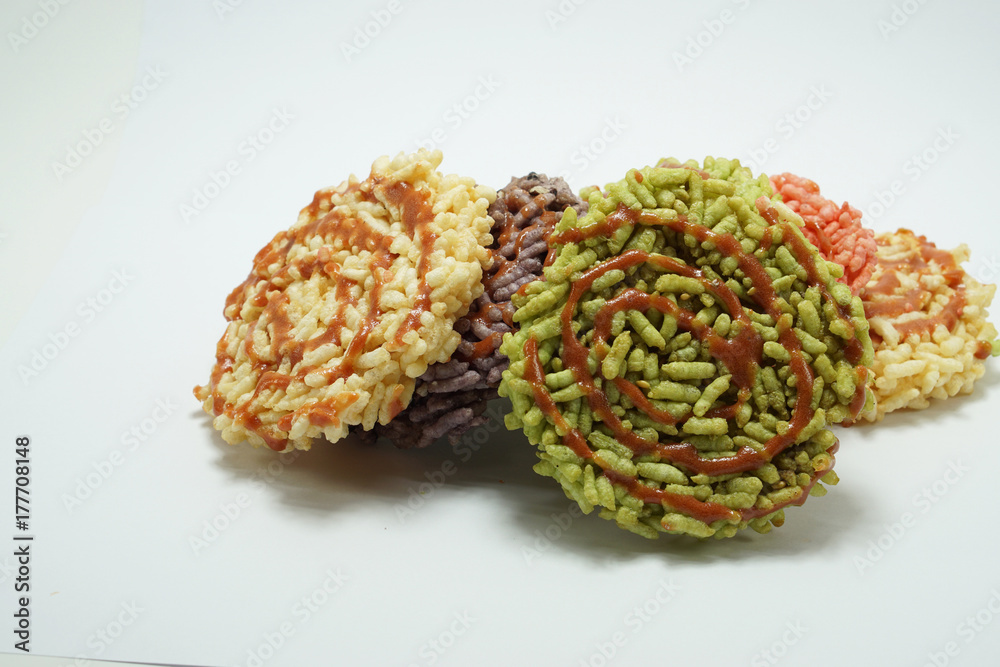 Rice cracker, Thai dessert isolated on white background. Multicolor rice cracker made from herbal coloring. Rice cracker, Thai dessert isolated on white background. Multicolor rice cracker made from herbal coloring.