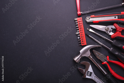 New square black tool box on black granite board background. Composition with free space for text or design photo
