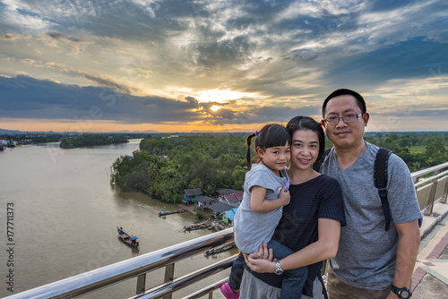 Asian family travel at Sri Surat bridge or Asian family outdoor at estuary