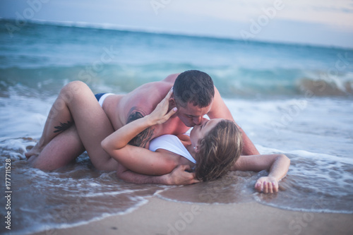 Erotic couple at the beach, sea view. Traveling at Bali.