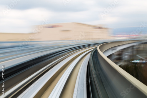 Motion blurred moving train track, transportation background