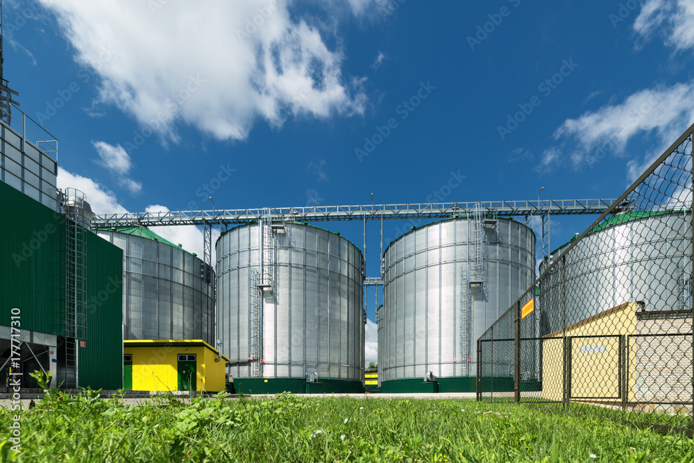 Modern large granary. Large metal silos. Modern large granary. Large metal silos.