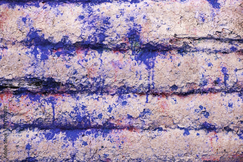 Fototapeta premium Background and wallpaper or texture of a pink wooden board with blue paint stains.