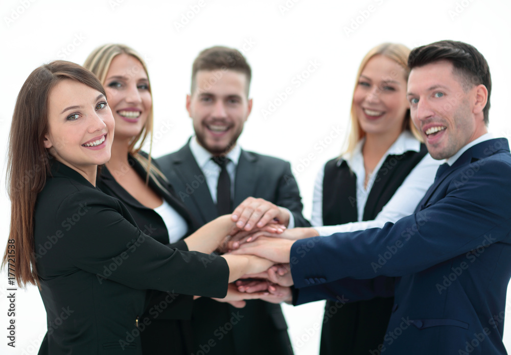 closeup.smiling business team with hands clasped together closeup.smiling business team with hands clasped together