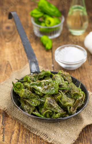 Fresh made Pimientos de Padron on a rustic background