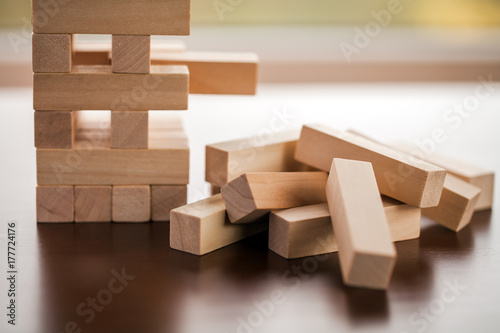 Jenga towerv isolated on a wooden background