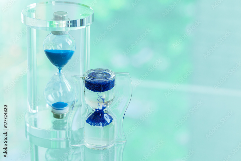 Time passing. Blue hourglass. Time passing. Blue hourglass.
