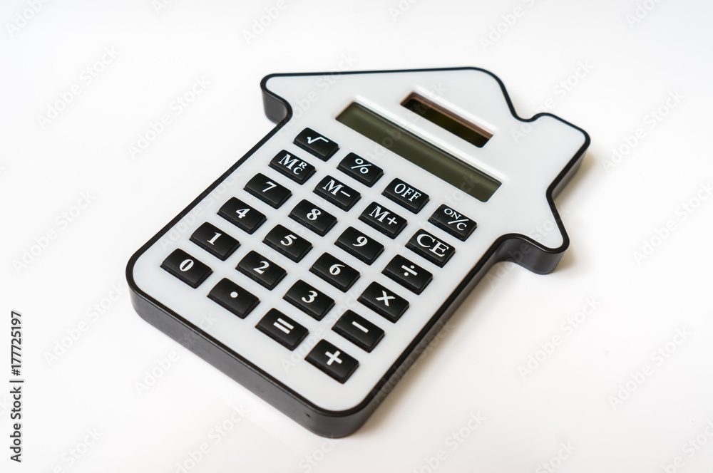 Calculator on white - real estate, lease and mortgage concept Calculator on white - real estate, lease and mortgage concept