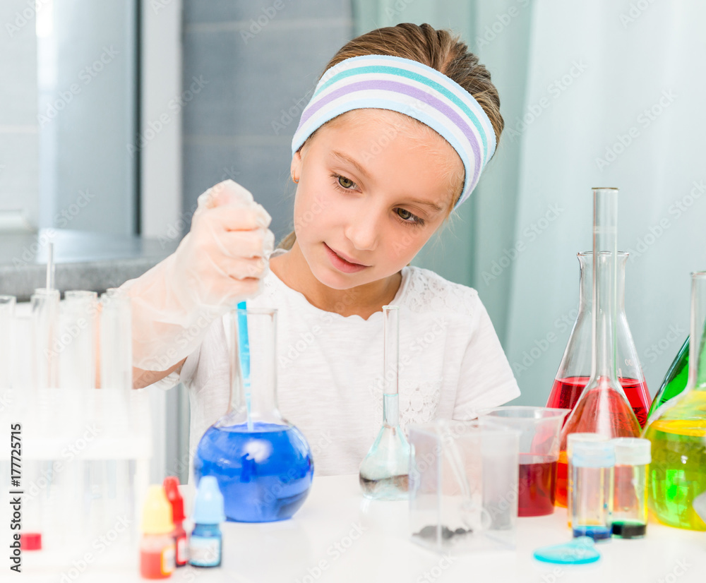 little girl with flasks for chemistry little girl with flasks for chemistry
