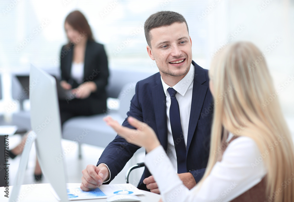 Fototapeta premium Manager talking with a colleague at the workplace