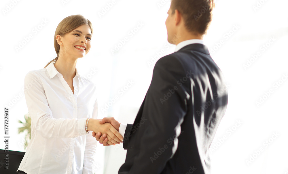 handshake young business woman with a colleague handshake young business woman with a colleague