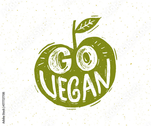 Go vegan slogan. Hand lettering in the shape of green apple.