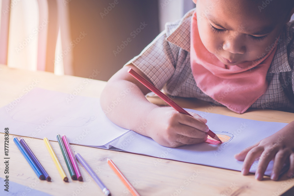 close up of a boy intend to drawing and painting a picture with worm tone close up of a boy intend to drawing and painting a picture with worm tone
