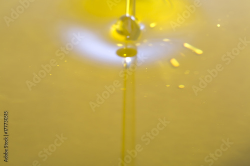 Closeup of olive oil waterfall.