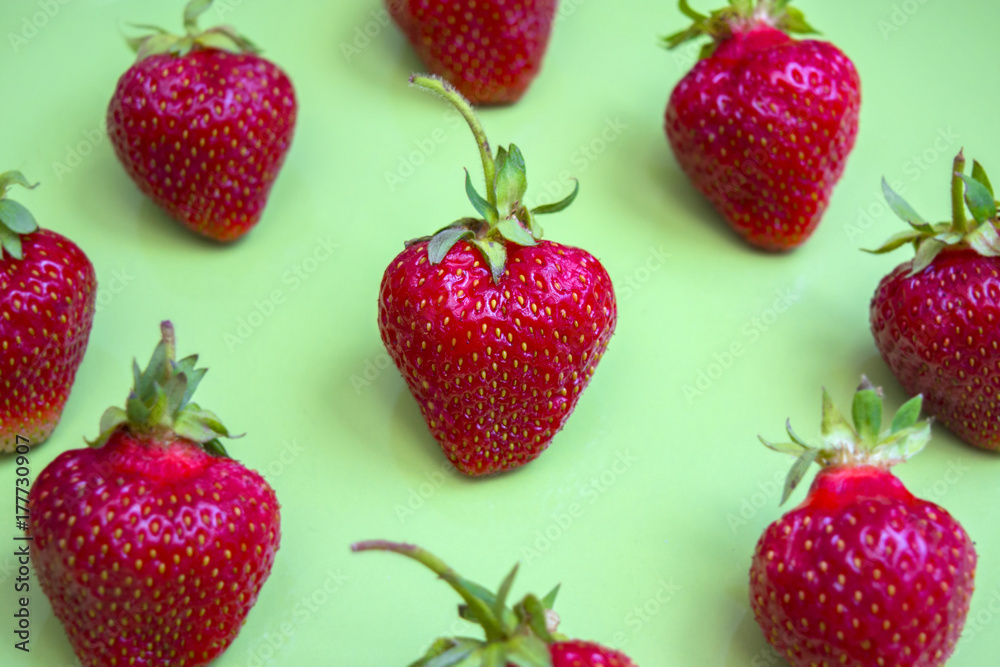 Ripe strawberries on a green plate Ripe strawberries on a green plate