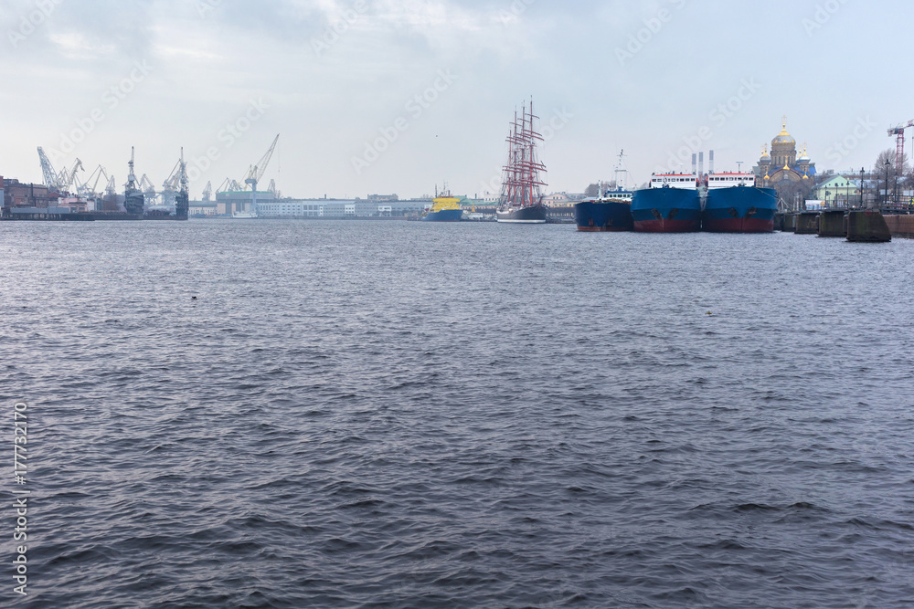View of river and sea ships on the Neva River in St. Petersburg near the Lieutenant Schmidt embankment. Russia
