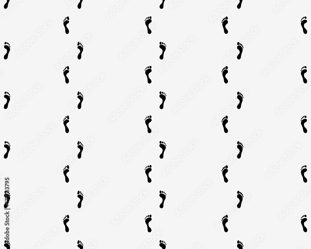 Fototapeta premium Prints of human feet on a white background, seamless