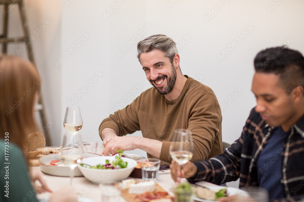 Friends enjoying a meal together Friends enjoying a meal together