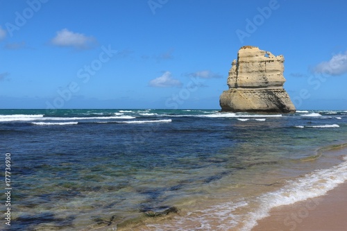 Blue water and sky background with one of the rocks called the twelve apostels, Australia photo