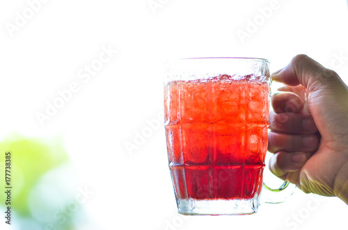 Red water and ice in a glass