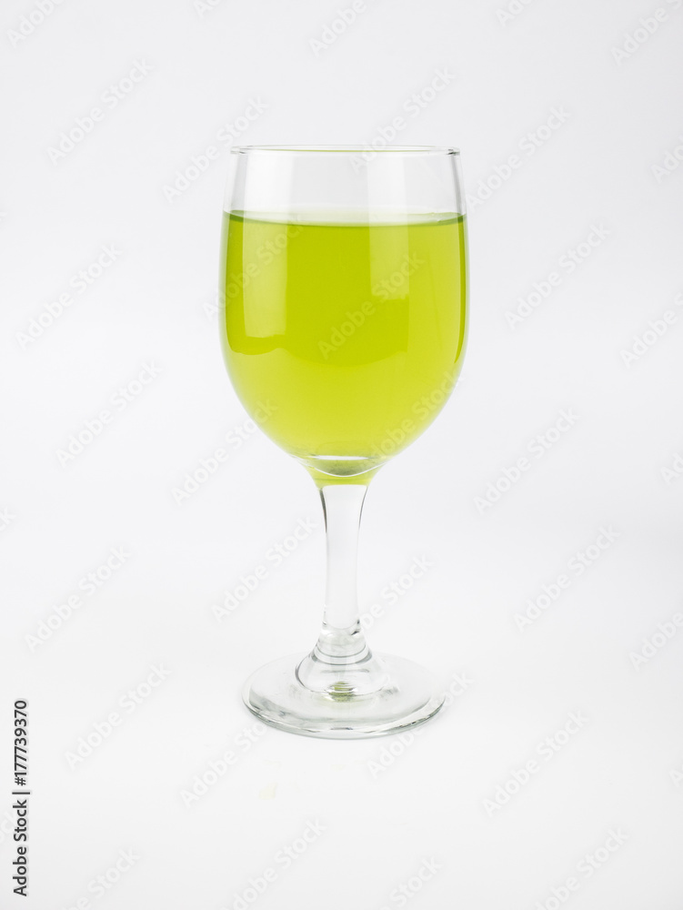 Pandan and pandan juice is made from the crushed or boiled. It health drink in clear glass.isolate on white background Pandan and pandan juice is made from the crushed or boiled. It health drink in clear glass.isolate on white background