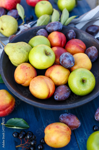 Mixed fruits on a wooden background