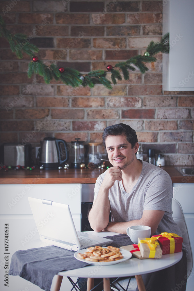 man with cup of tea or coffee and laptop computer man with cup of tea or coffee and laptop computer