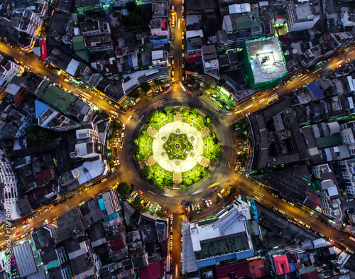 Aerial view Road roundabout, Expressway with car lots in the city in Thailand.beautiful Street , downtown,cityscape,Top view. Background,Aerial view city scape © MAGNIFIER