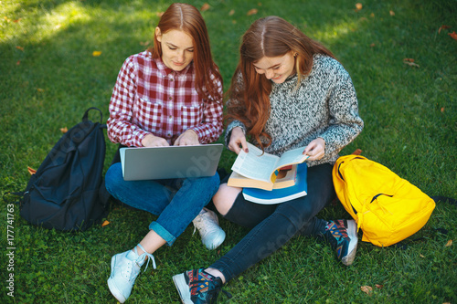 Students studying outdoors on campus at the university