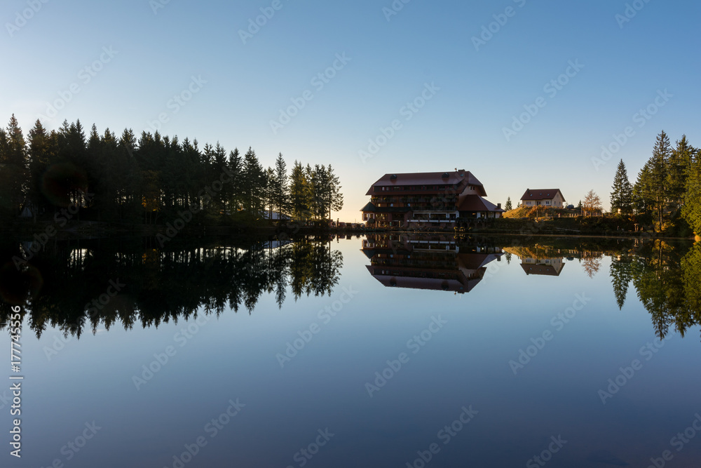 Fototapeta premium Autumn landscape - Black Forest. A small lake in the high mountains of the Black Forest in autumn.