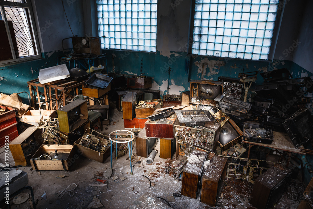 Group of old antique retro television or broken TV boxes in dark creepy
