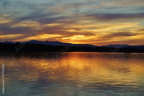 Dramatic orange sunset of the Lake Burley Griffin in Canberra  ACT  Australia
