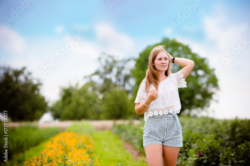 beautiful woman in the field of flowers