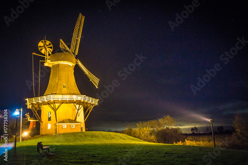 Windmühle in Greetsiel bei Nacht, Deutschland photo