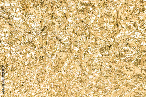 Gold wrinkled paper texture abstract background
