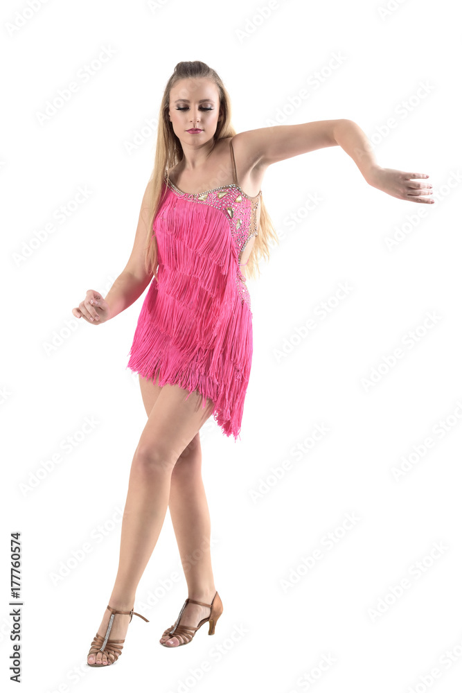 Gracious elegant feminine woman dancing rumba in pink costume. Full body length portrait isolated on white studio background. Gracious elegant feminine woman dancing rumba in pink costume. Full body length portrait isolated on white studio background.
