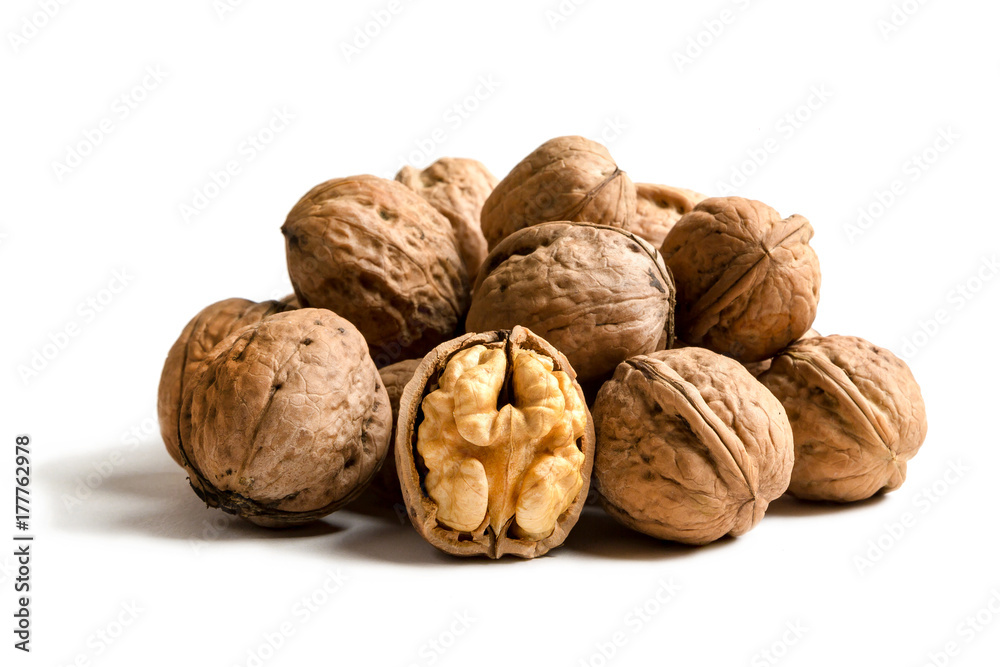 A handful of walnuts isolated on a white background A handful of walnuts isolated on a white background