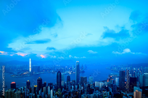 Hong Kong skyline and Victoria harbor. View from the Peak at twilight dusk