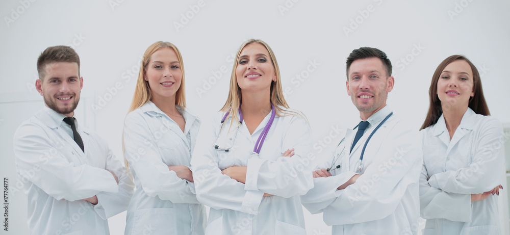 Confident doctors posing and smiling at camera Confident doctors posing and smiling at camera
