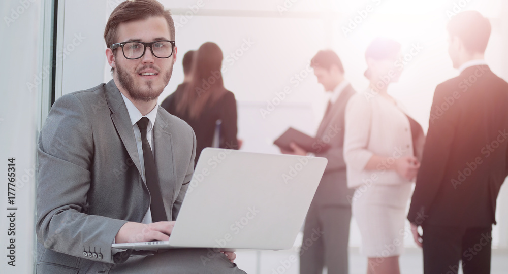 Fototapeta premium communication concept:businessman with a stylish laptop on the k