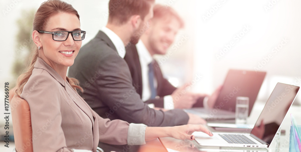 Beautiful modern businesswoman working with her colleagues on Beautiful modern businesswoman working with her colleagues on