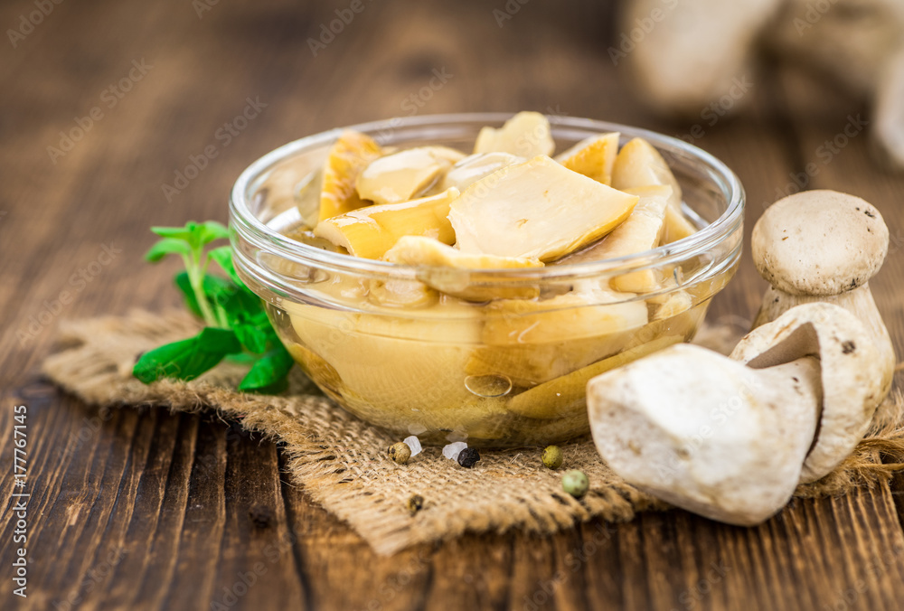 Fresh made Canned Porcinis on a rustic background Fresh made Canned Porcinis on a rustic background