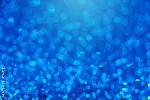 Blue bright abstract bokeh background. Sparkle texture for birthday card or wedding, christmas, new year, valentine's day, party and other holidays invitation backdrop.