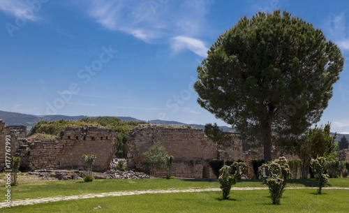 Beautiful background with ancient ruins and Sunny summer day. The old ruined walls of the ancient city .