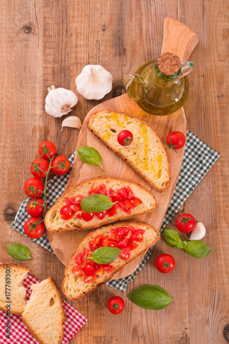 Bruschetta bread with basil and chopped tomatoes. 