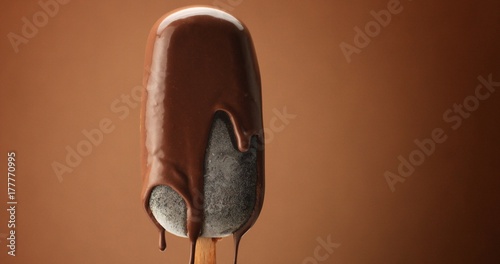 Принти на полотні chocolate ice cream on a stick and liquid chocolate covered it