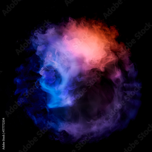 colored smoke on a black background.