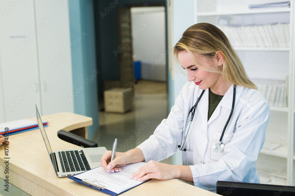 Young smiling receptionist in dental clinic Young smiling receptionist in dental clinic