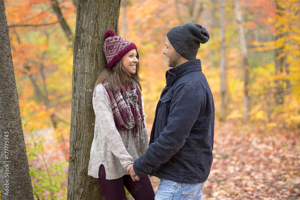 Young couple in love in a park on a autumn day Young couple in love in a park on a autumn day