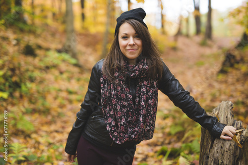 Portrait of cheerful young woman in autumn season